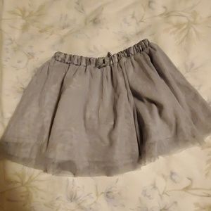 1skirt, 5 shirts, 1 jacket, 1 pair of blue jeans.